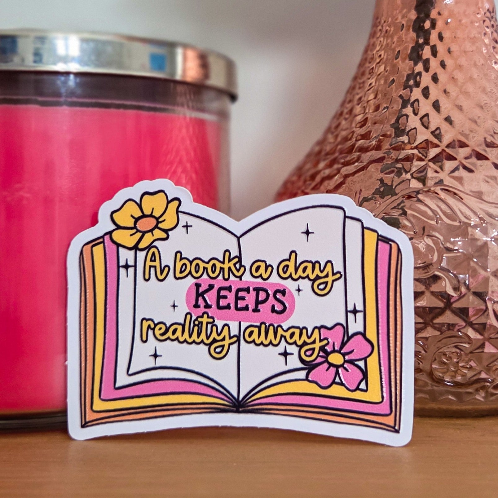 A Book a Day Keeps Reality Away Sticker