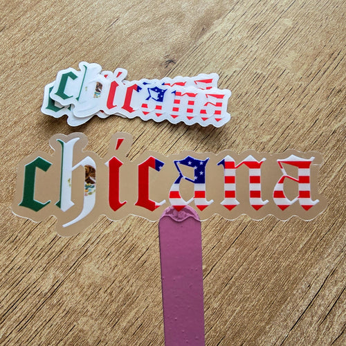 Clear 'chicana' sticker with American and Mexican flag design on a wooden surface