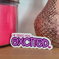 Pink textured vase and pink candle on a wooden surface with 'excited' text overlay.